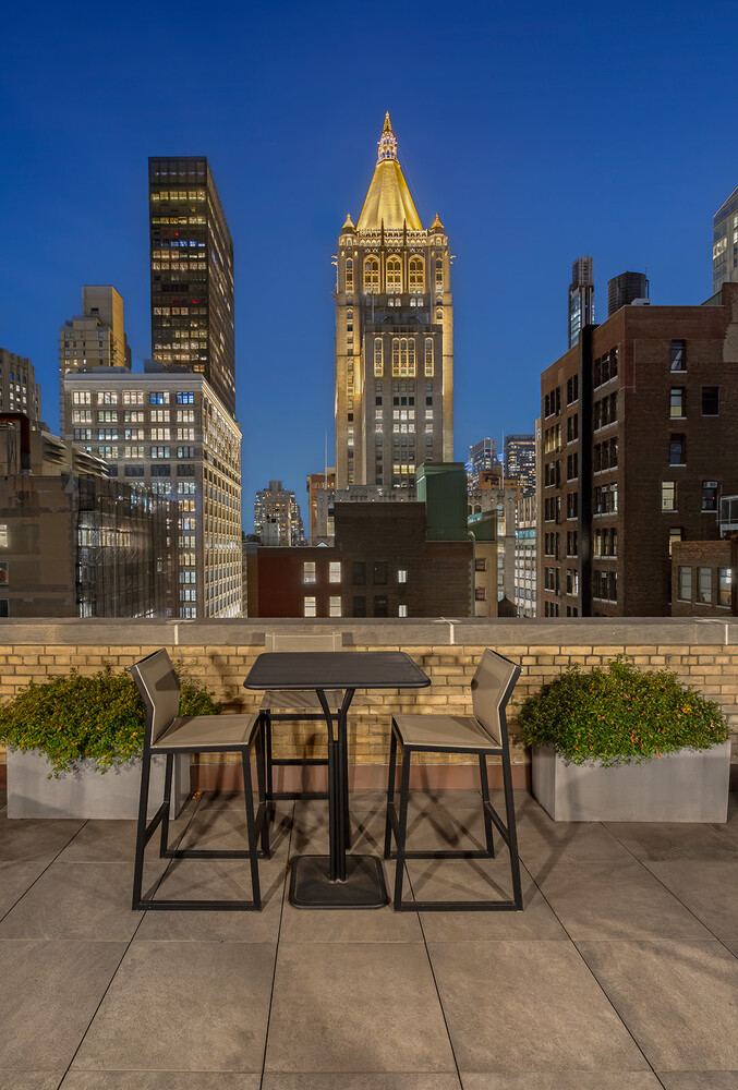 88 Lexington Avenue, Unit 1506 Manhattan, NY 10010 - Photo 6 of 16 a view of a chairs and table in the patio