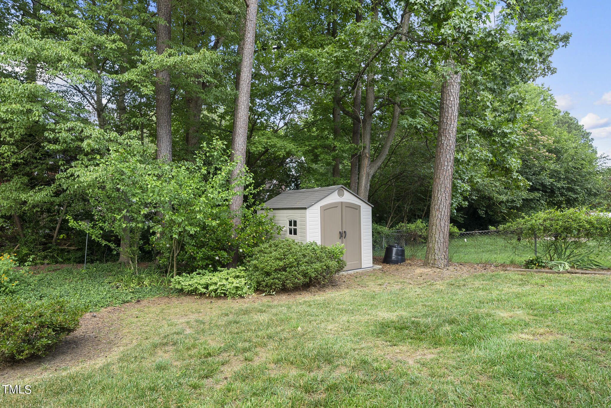 5213 Old Forge Circle Raleigh, NC 27609 - Photo 12 of 37 a view of a house with backyard and garden