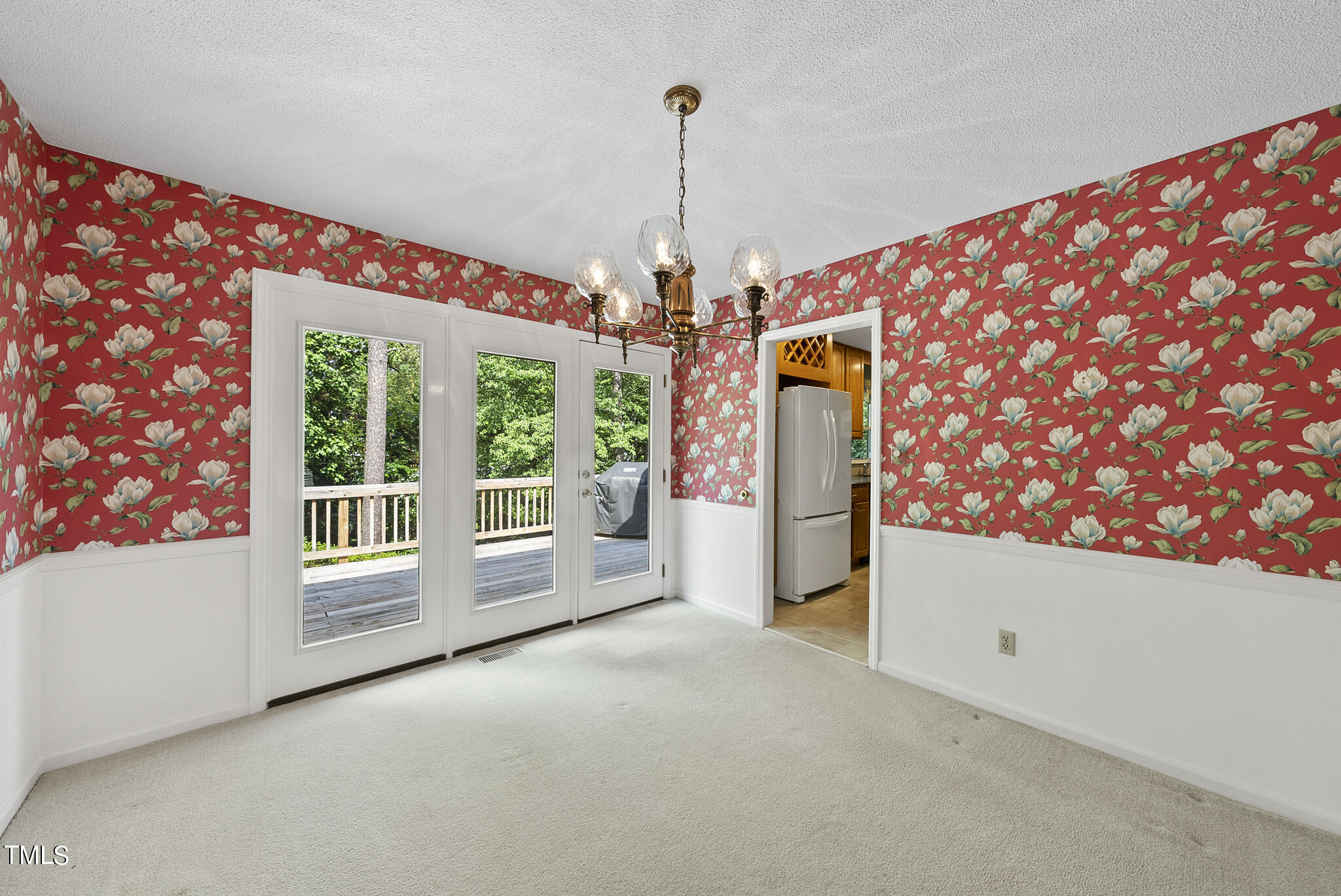 5213 Old Forge Circle Raleigh, NC 27609 - Photo 17 of 37 a view of a big room with windows and chandelier