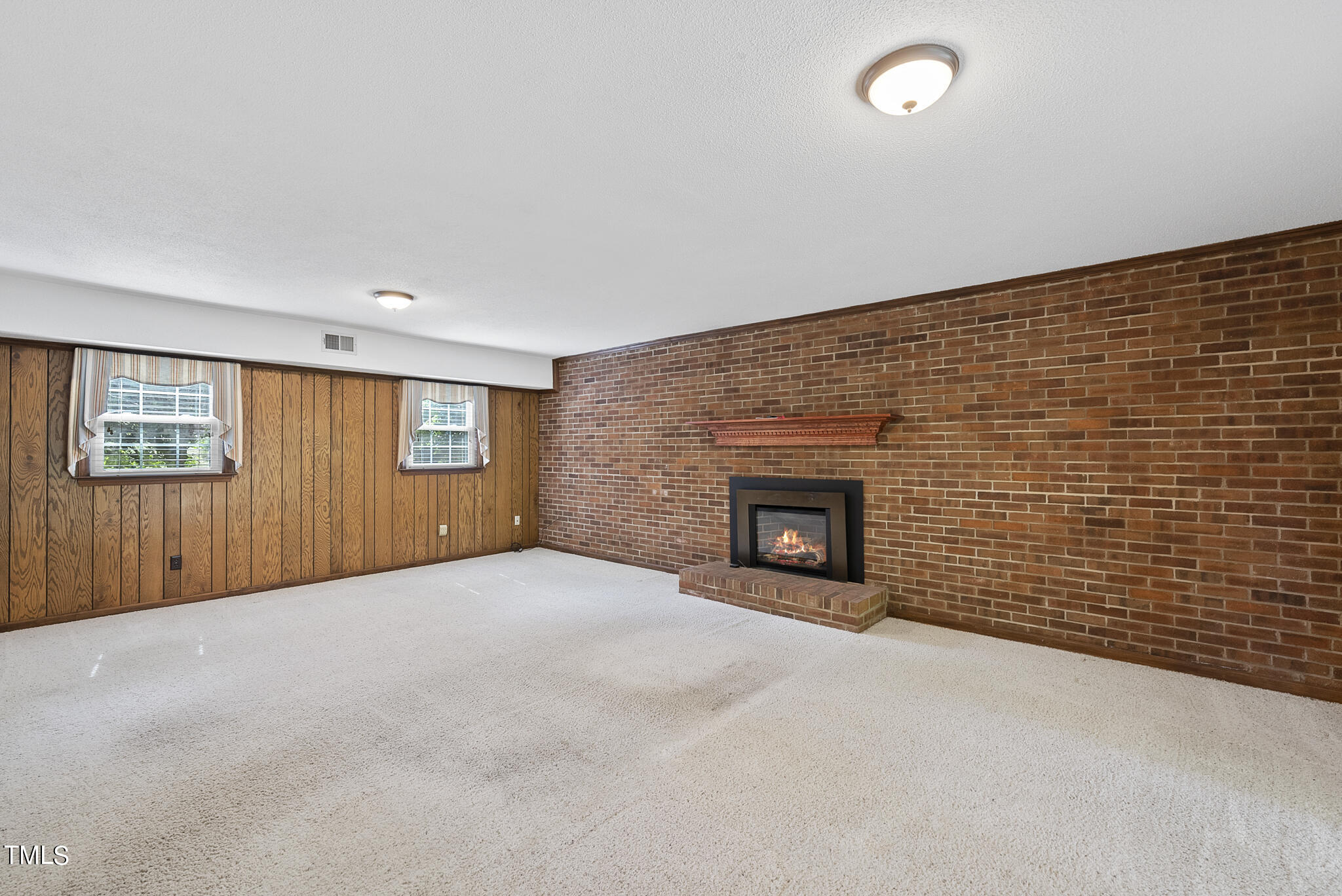 5213 Old Forge Circle Raleigh, NC 27609 - Photo 23 of 37 an empty room with a fireplace