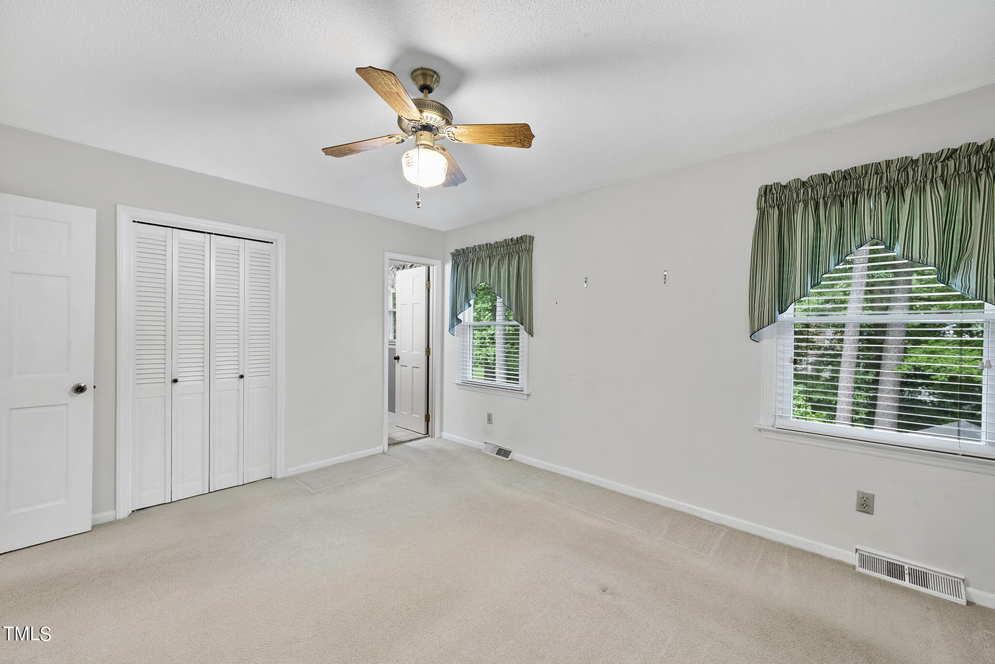 5213 Old Forge Circle Raleigh, NC 27609 - Photo 26 of 37 a view of an empty room with a window