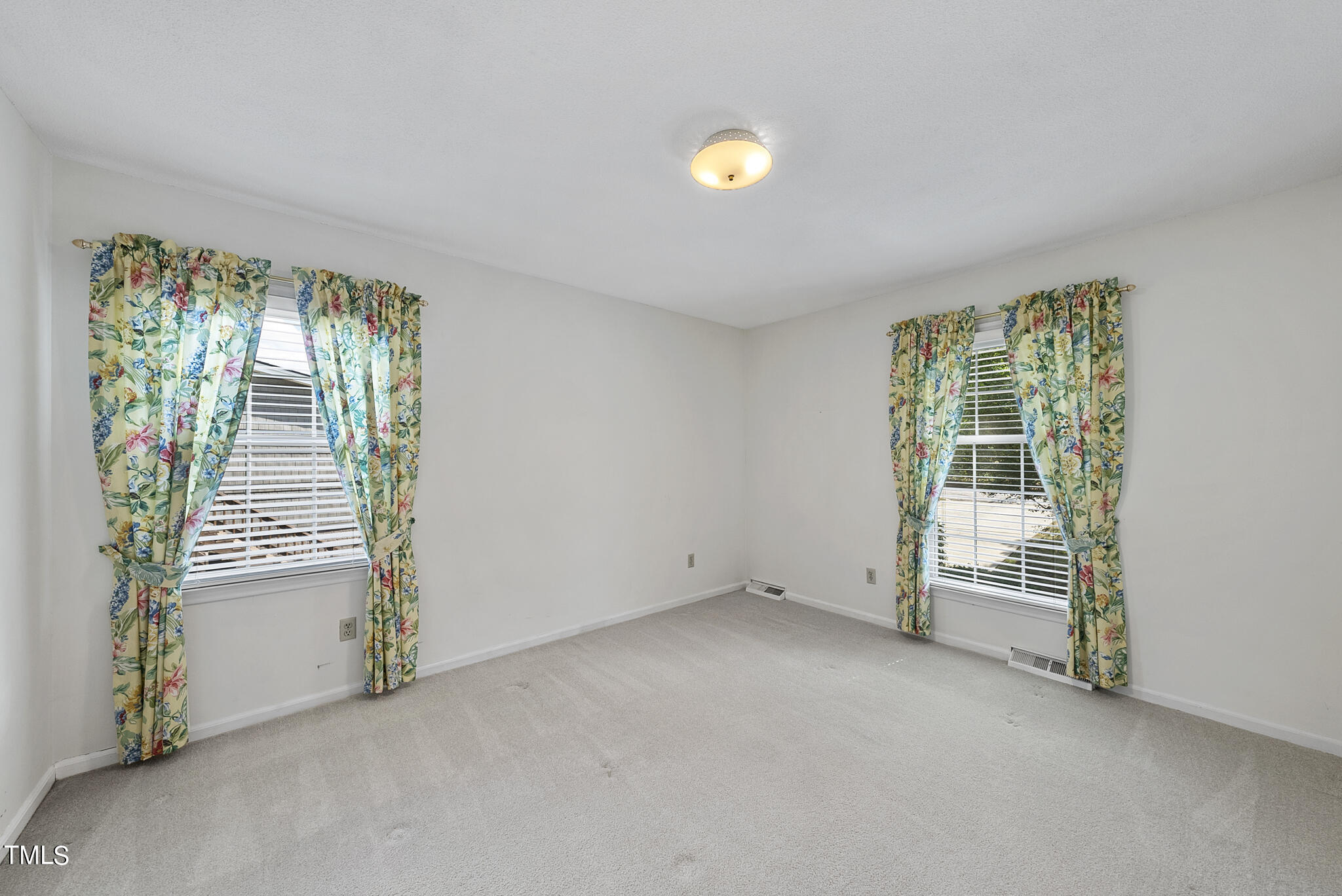 5213 Old Forge Circle Raleigh, NC 27609 - Photo 27 of 37 an empty room with windows