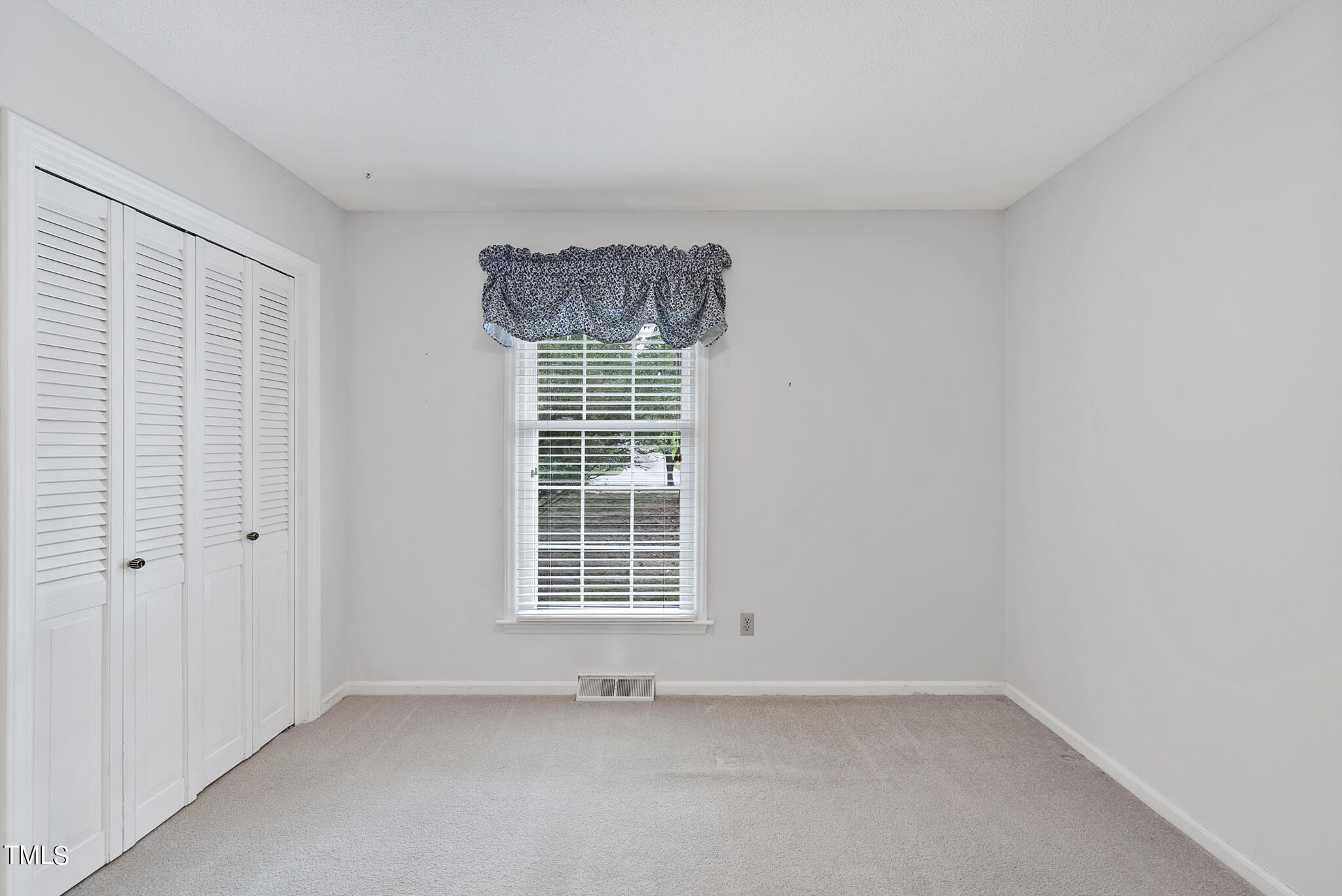 5213 Old Forge Circle Raleigh, NC 27609 - Photo 29 of 37 an empty room with windows