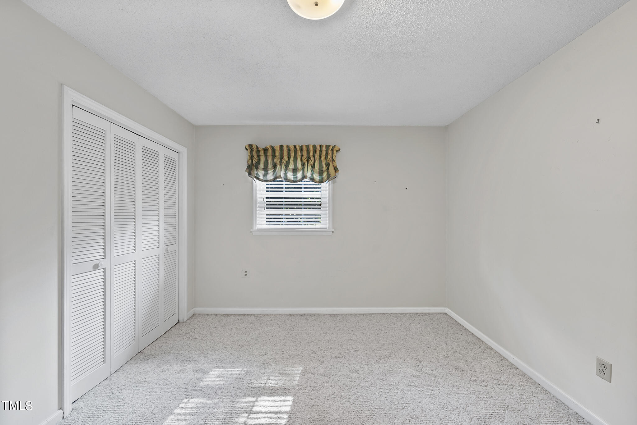 5213 Old Forge Circle Raleigh, NC 27609 - Photo 30 of 37 an empty room with a window