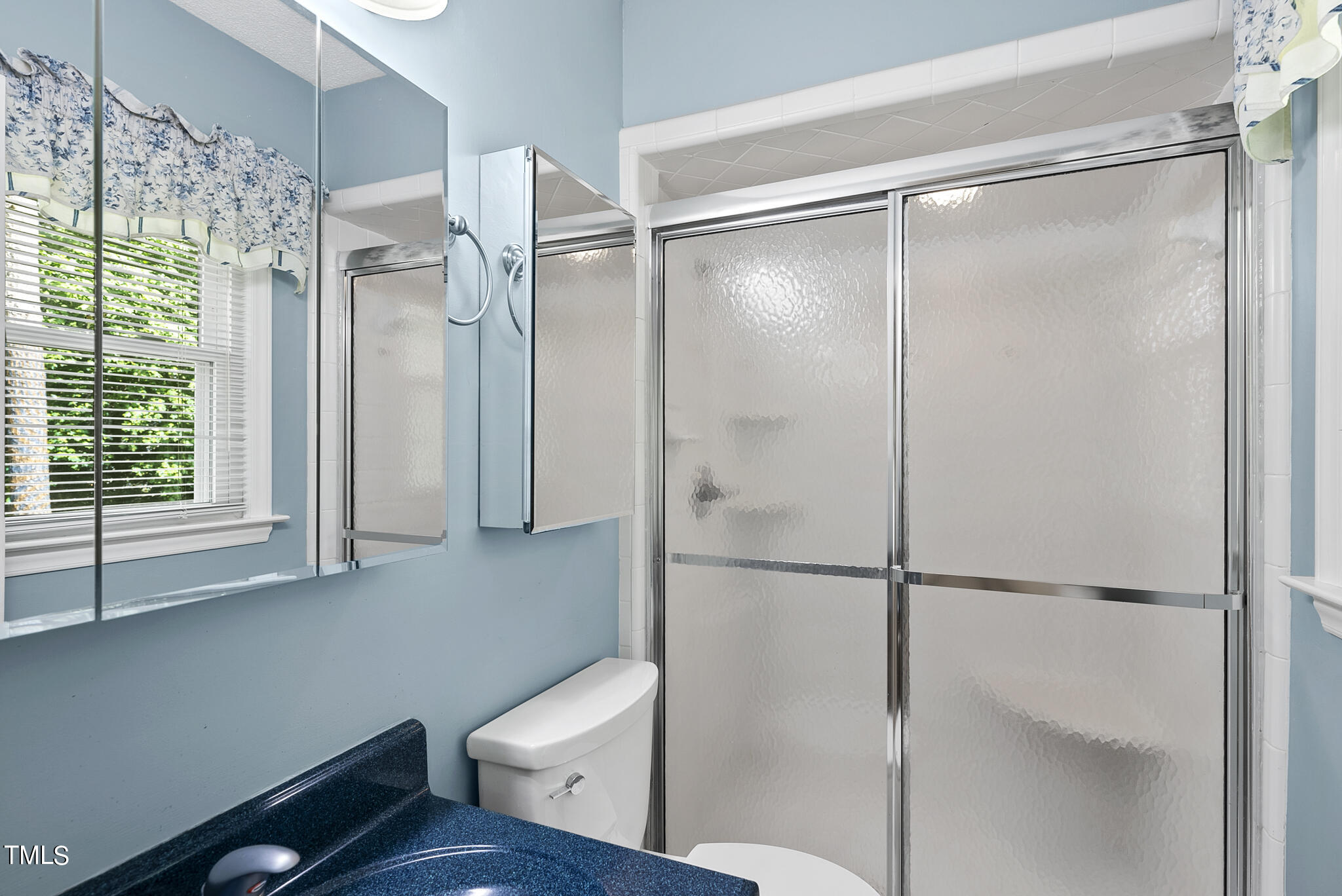 5213 Old Forge Circle Raleigh, NC 27609 - Photo 32 of 37 a bathroom with a shower and a toilet