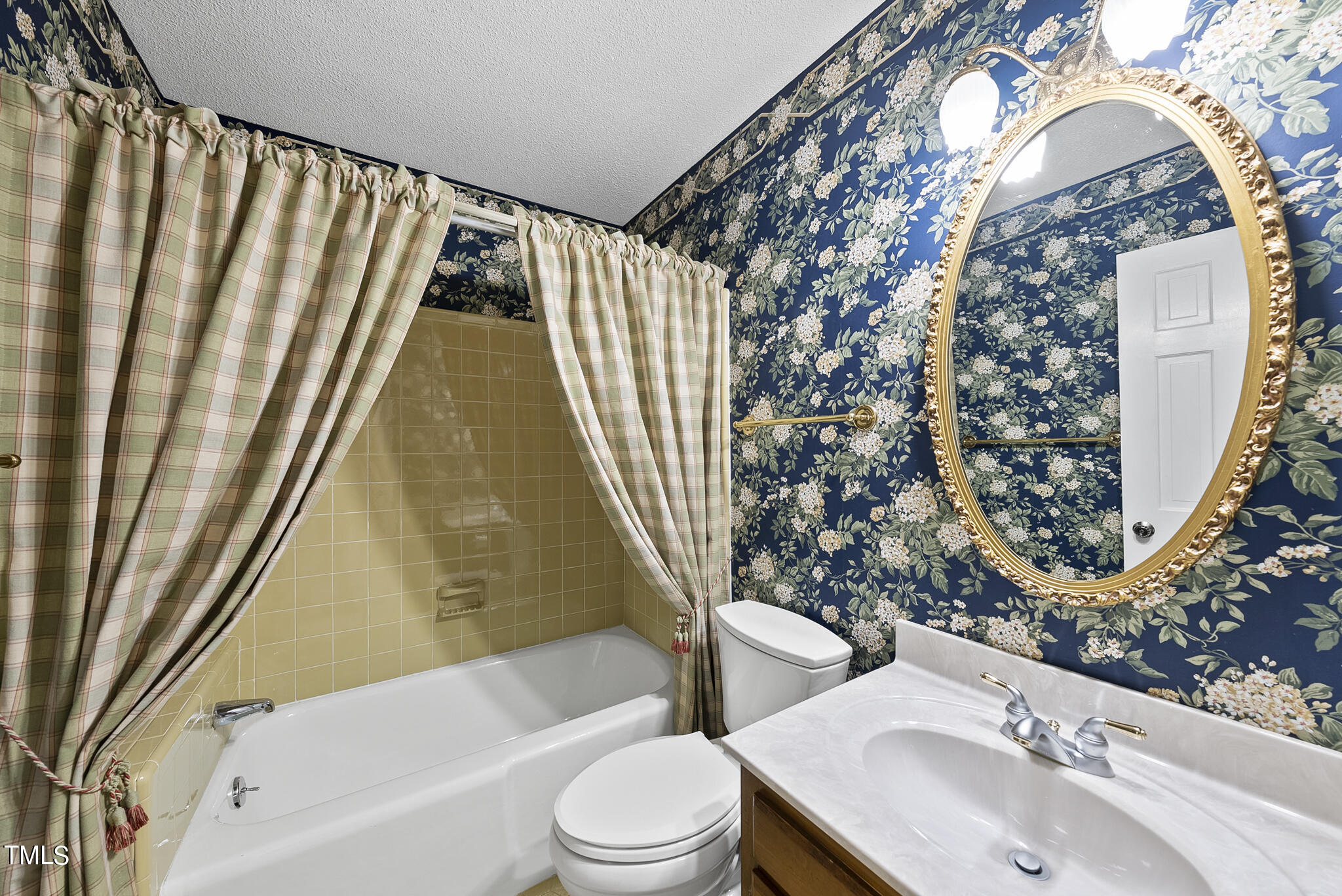 5213 Old Forge Circle Raleigh, NC 27609 - Photo 33 of 37 a bathroom with a sink toilet and shower