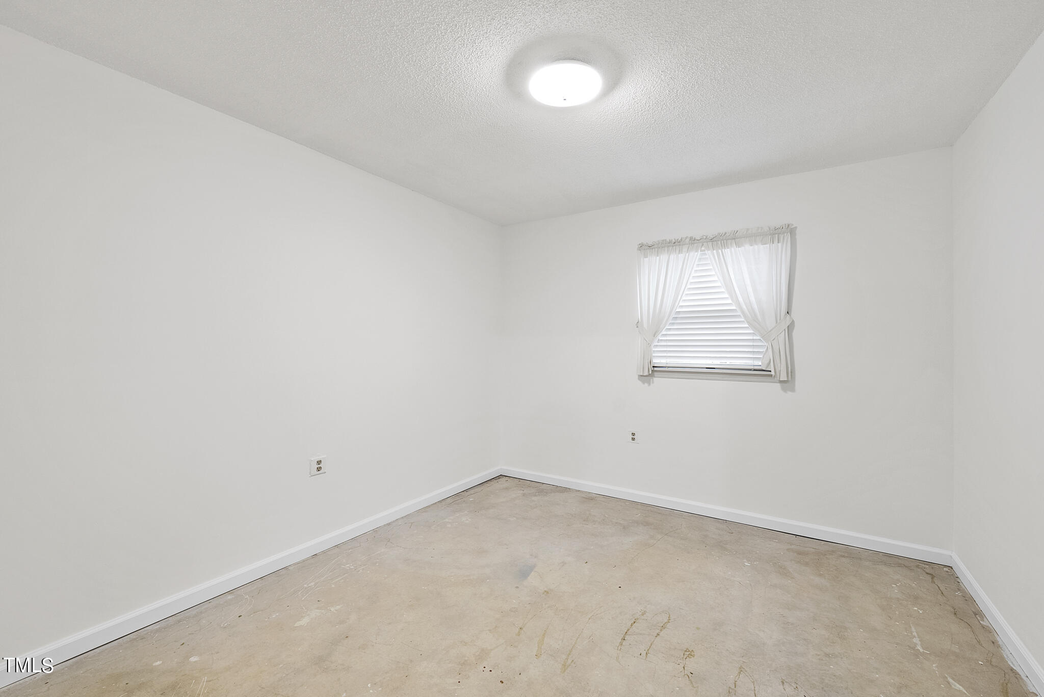 5213 Old Forge Circle Raleigh, NC 27609 - Photo 35 of 37 an empty room with a empty space and windows
