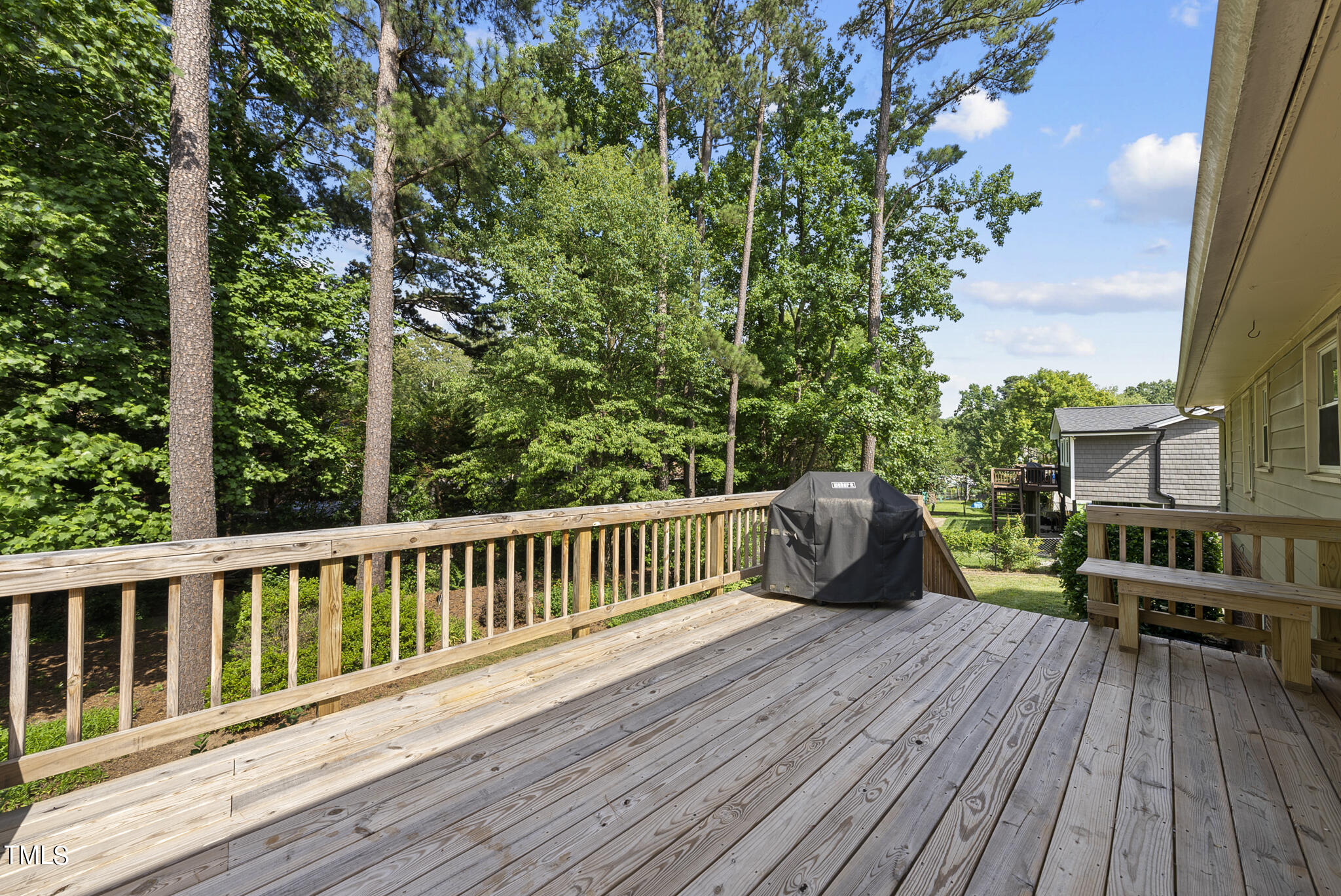 5213 Old Forge Circle Raleigh, NC 27609 - Photo 10 of 37 a view of a wooden deck with a bench