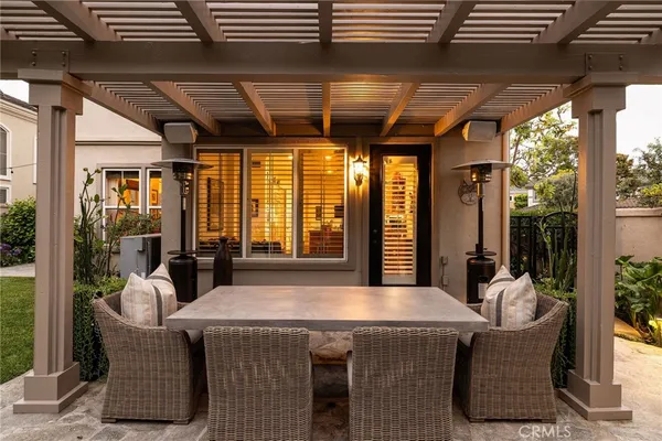 a outdoor space with patio lots of furniture and large windows