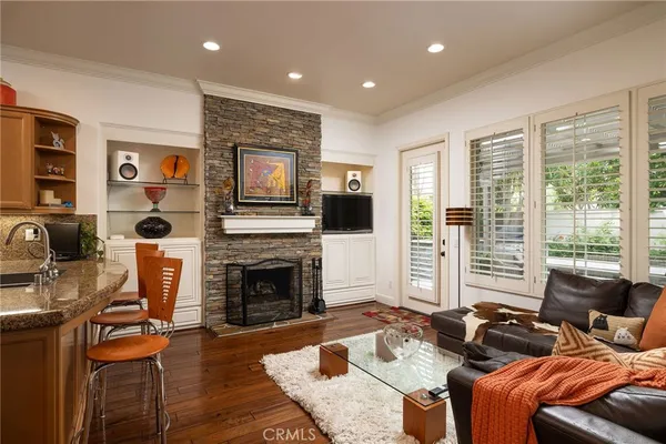 a living room with furniture fireplace and flat screen tv