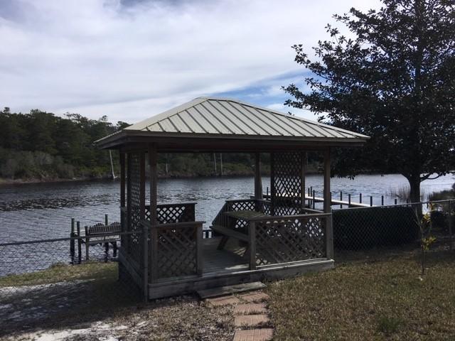95 Blue Lake Road Santa Rosa Beach, FL 32459 - Photo 5 of 11 a front view of a house with a garden