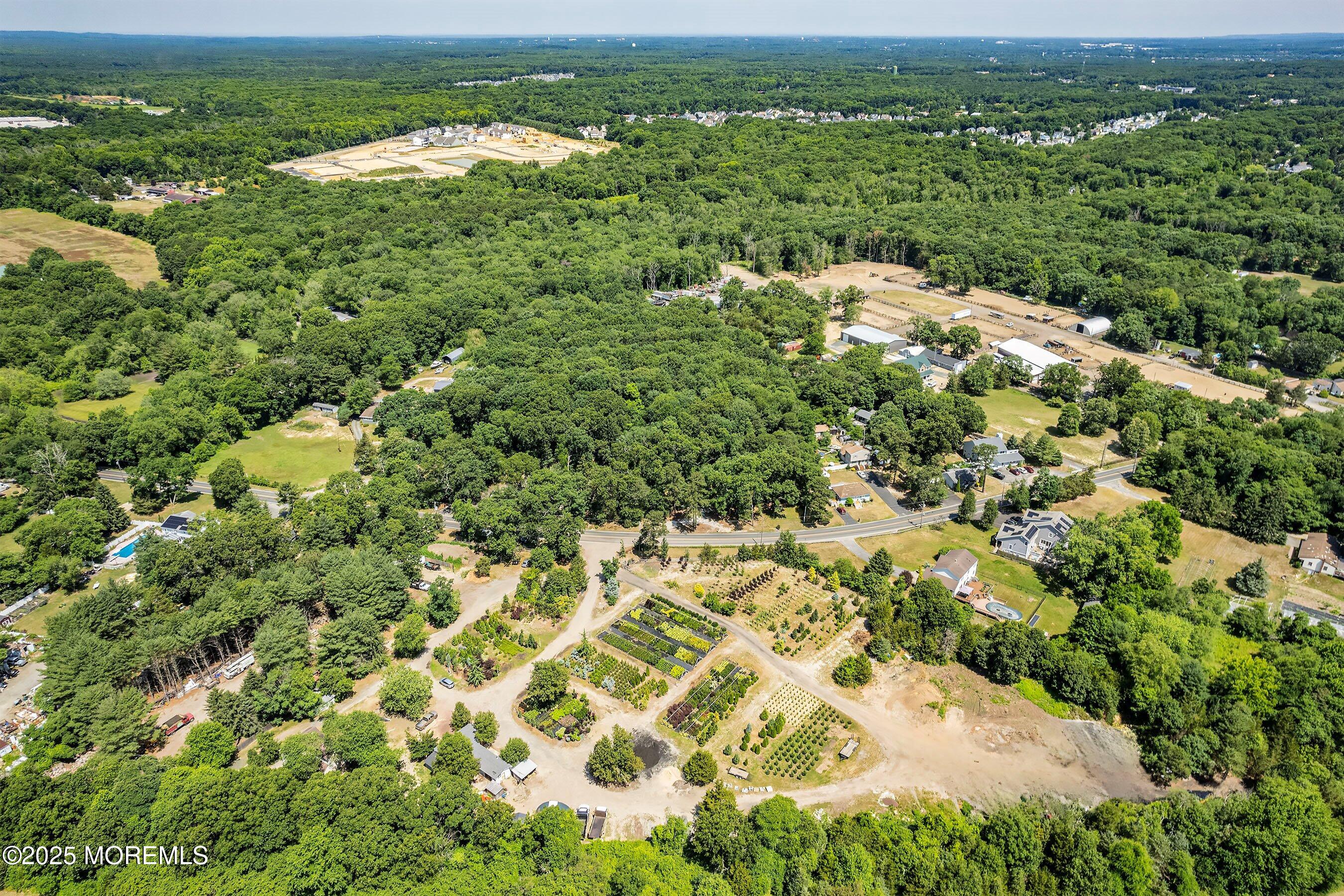 763 Hulses Corner Road Howell, NJ 07731 - Photo 5 of 34 an aerial view of residential houses with outdoor space and trees