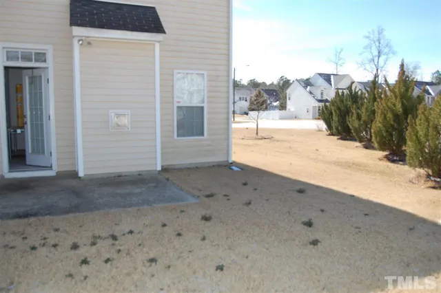 a view of a backyard of a house