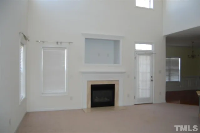 a big room with closet and a fireplace