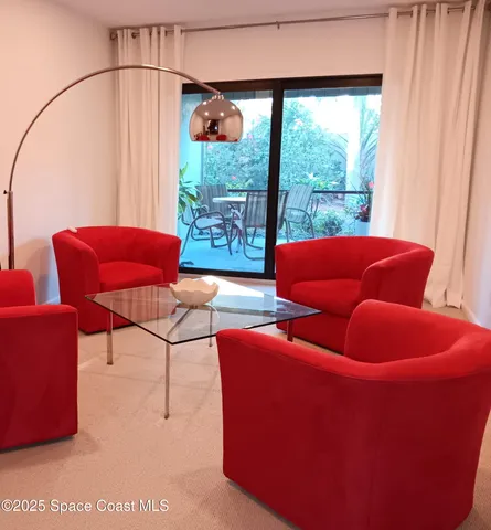 a blue chair sitting in front of a window