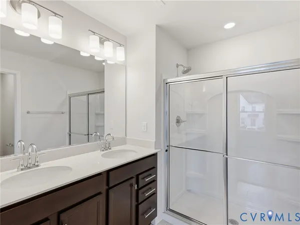 a bathroom with a double vanity sink mirror and double