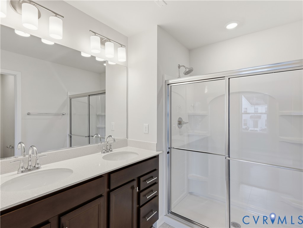 334 Mt Mccauley Way Aylett, VA 23009 - Photo 14 of 20 a bathroom with a double vanity sink mirror and double
