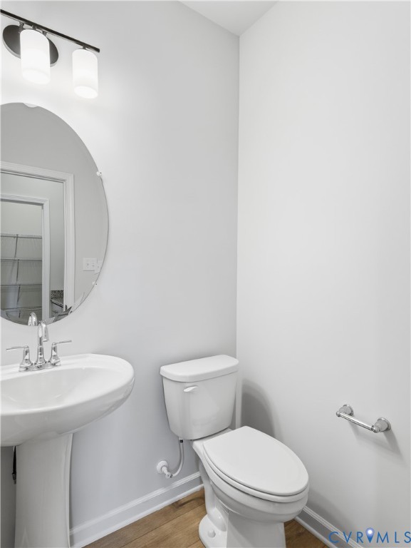 334 Mt Mccauley Way Aylett, VA 23009 - Photo 19 of 20 a bathroom with a toilet a sink and mirror