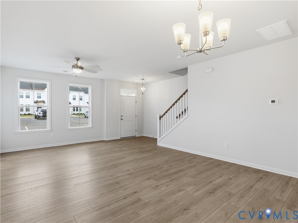334 Mt Mccauley Way Aylett, VA 23009 - Photo 9 of 20 wooden floor in an empty room with a window
