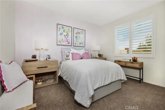 a bedroom with a bed and a table