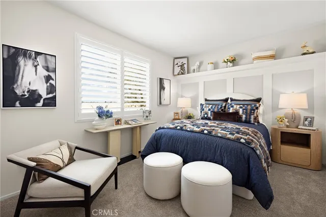 a bedroom with a bed and a table with chair