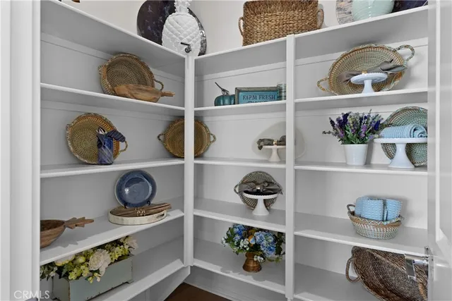 a shelf with books and knick knacks on it