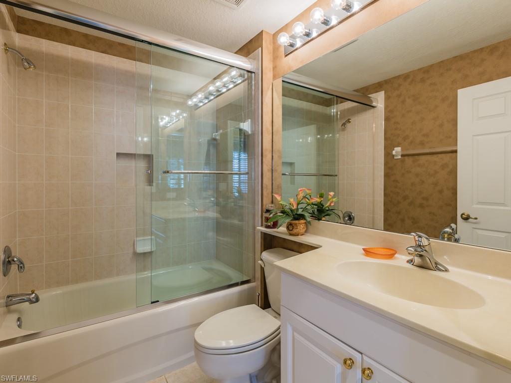 20117 Seadale Court Estero, FL 33928 - Photo 12 of 35 a bathroom with a sink a toilet and shower