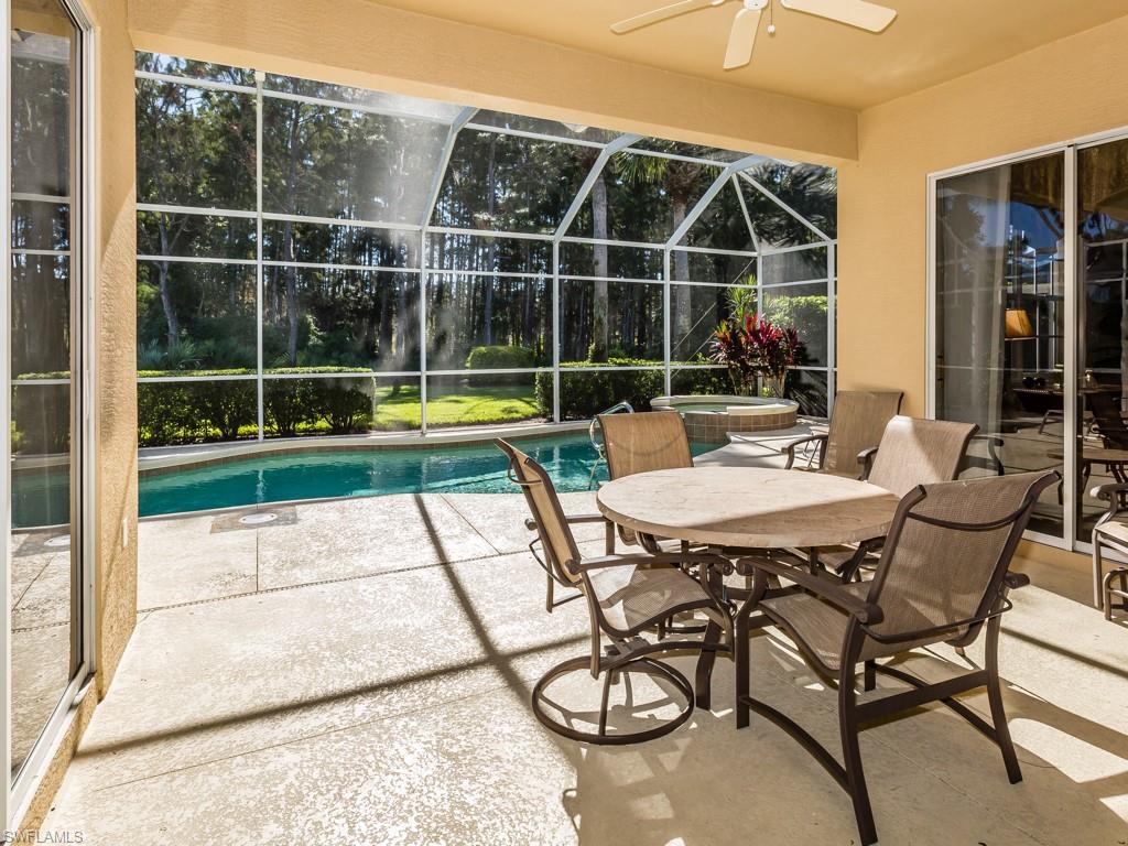 20117 Seadale Court Estero, FL 33928 - Photo 13 of 35 a view of a dinning table and chairs in the patio