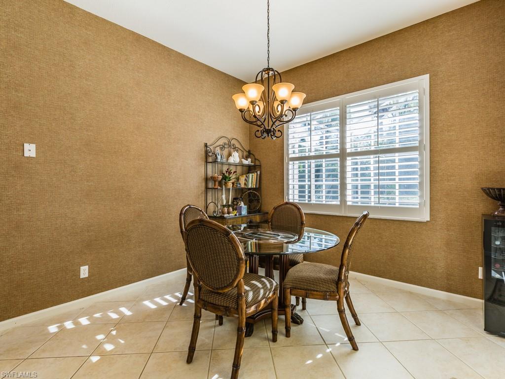 20117 Seadale Court Estero, FL 33928 - Photo 5 of 35 a view of a dining room with furniture and a chandelier