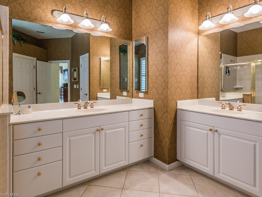 20117 Seadale Court Estero, FL 33928 - Photo 8 of 35 a bathroom with a double vanity sink and a mirror