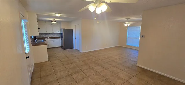 a view of a kitchen with a sink and cabinets
