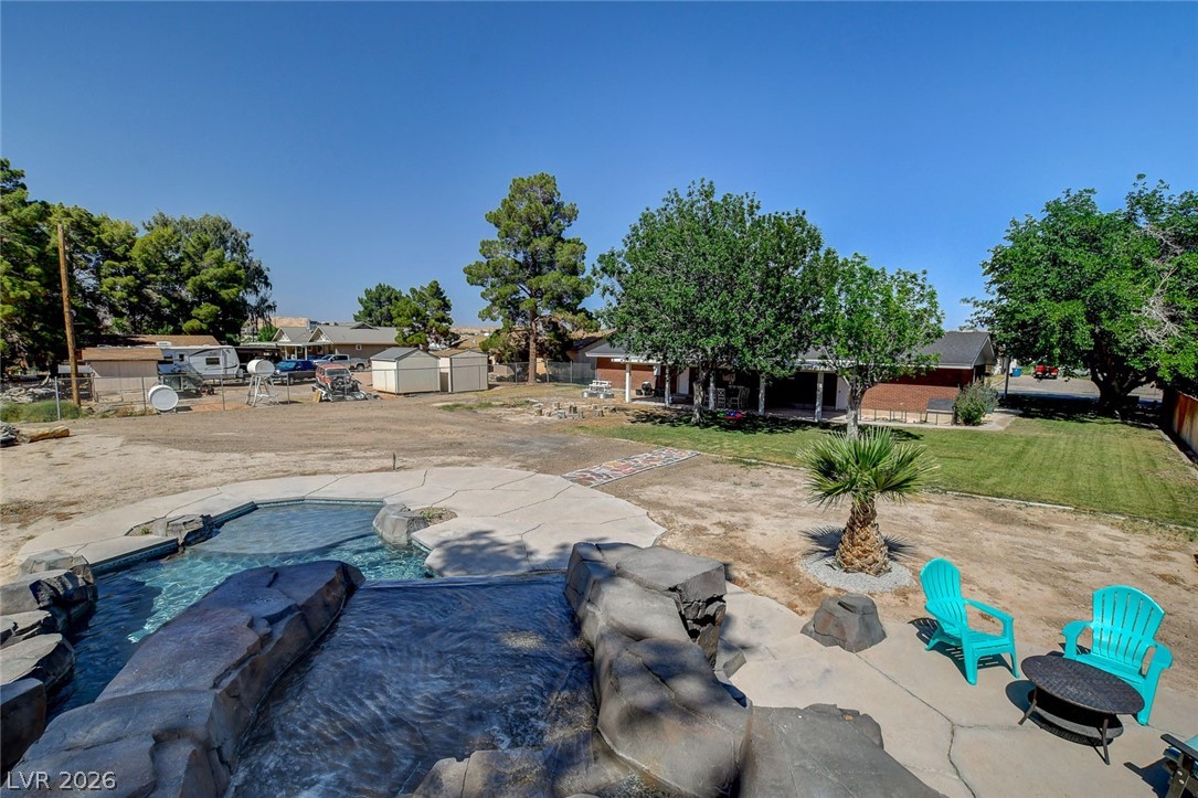 3765 Berkeley Street Logandale, NV 89021 - Photo 78 of 87 This spacious yard offers a private pool, perfect for outdoor living and entertaining.
