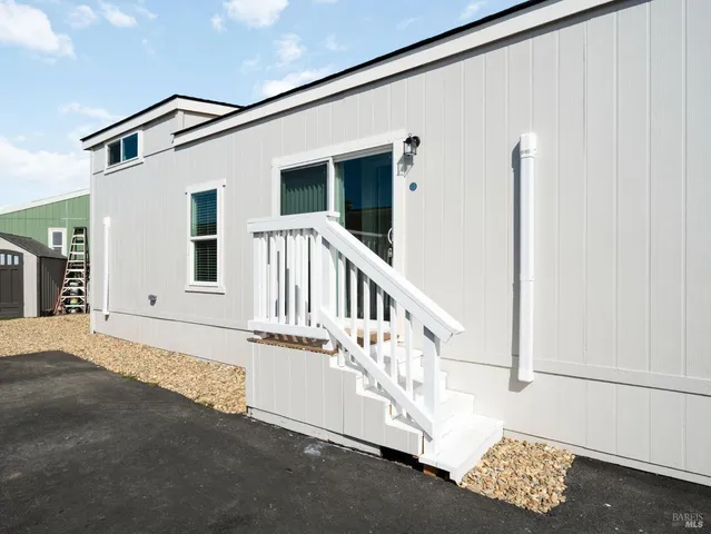 a view of an house with a street