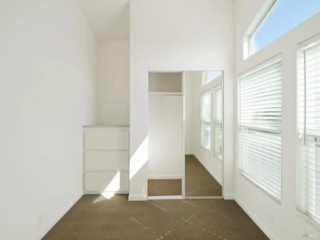 a view of a hallway with windows