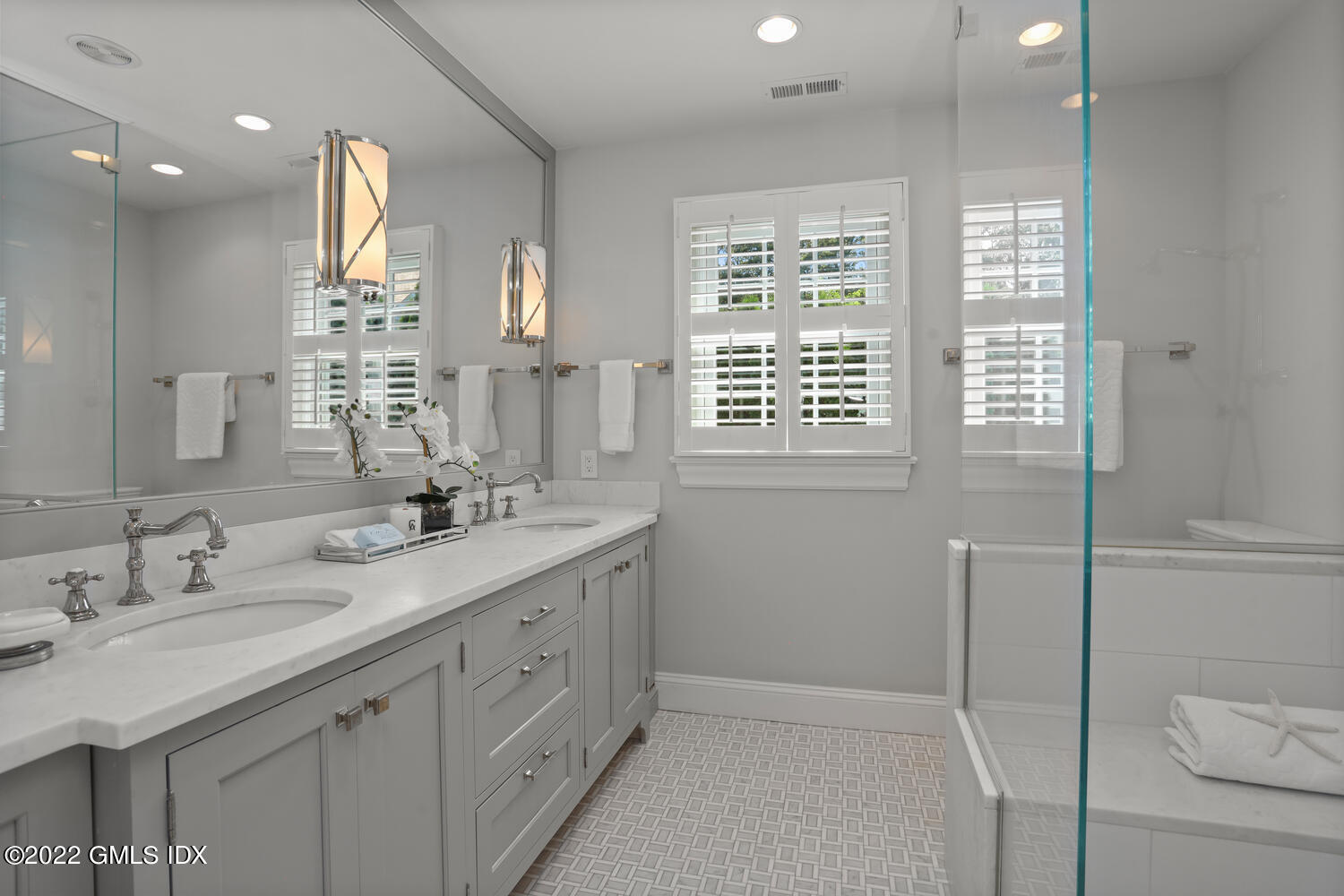 47 Druid Lane Riverside, CT 06878 - Photo 15 of 29 a spacious bathroom with double sink a a mirror and a shower