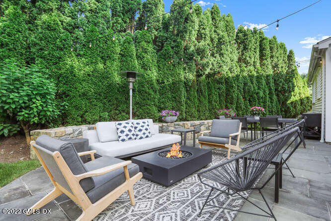 47 Druid Lane Riverside, CT 06878 - Photo 24 of 29 a view of a patio with couches and chairs