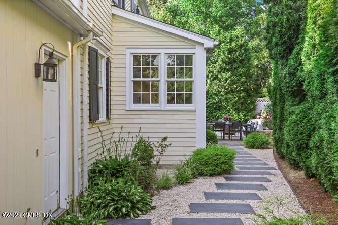 47 Druid Lane Riverside, CT 06878 - Photo 25 of 29 a front view of a house with garden