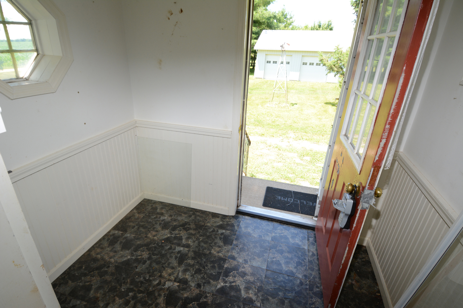 6115 South University Road Shabbona, IL 60550 - Photo 14 of 37 a view of an empty room with a window