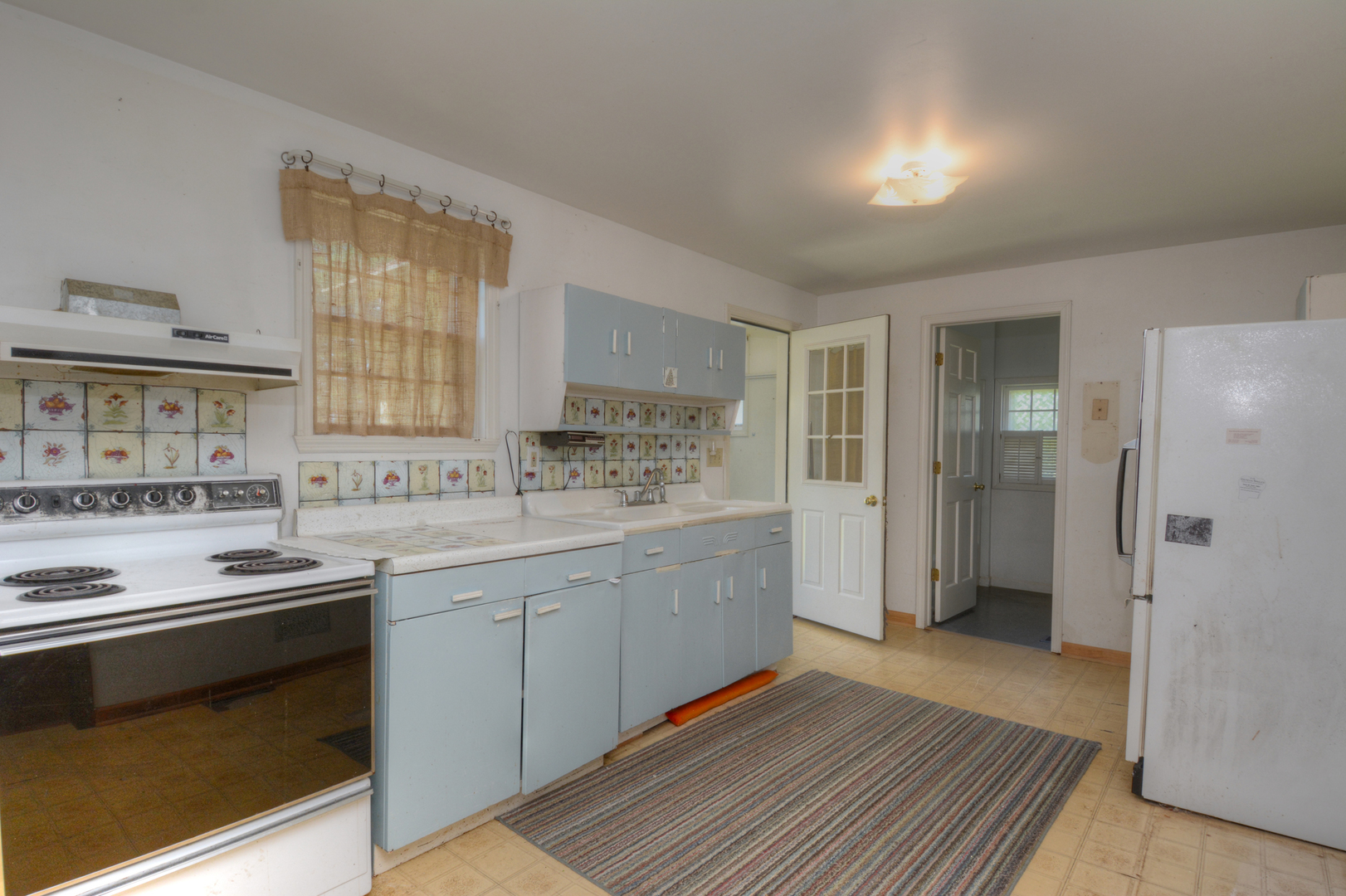 6115 South University Road Shabbona, IL 60550 - Photo 15 of 37 a kitchen with stainless steel appliances granite countertop a refrigerator and a stove