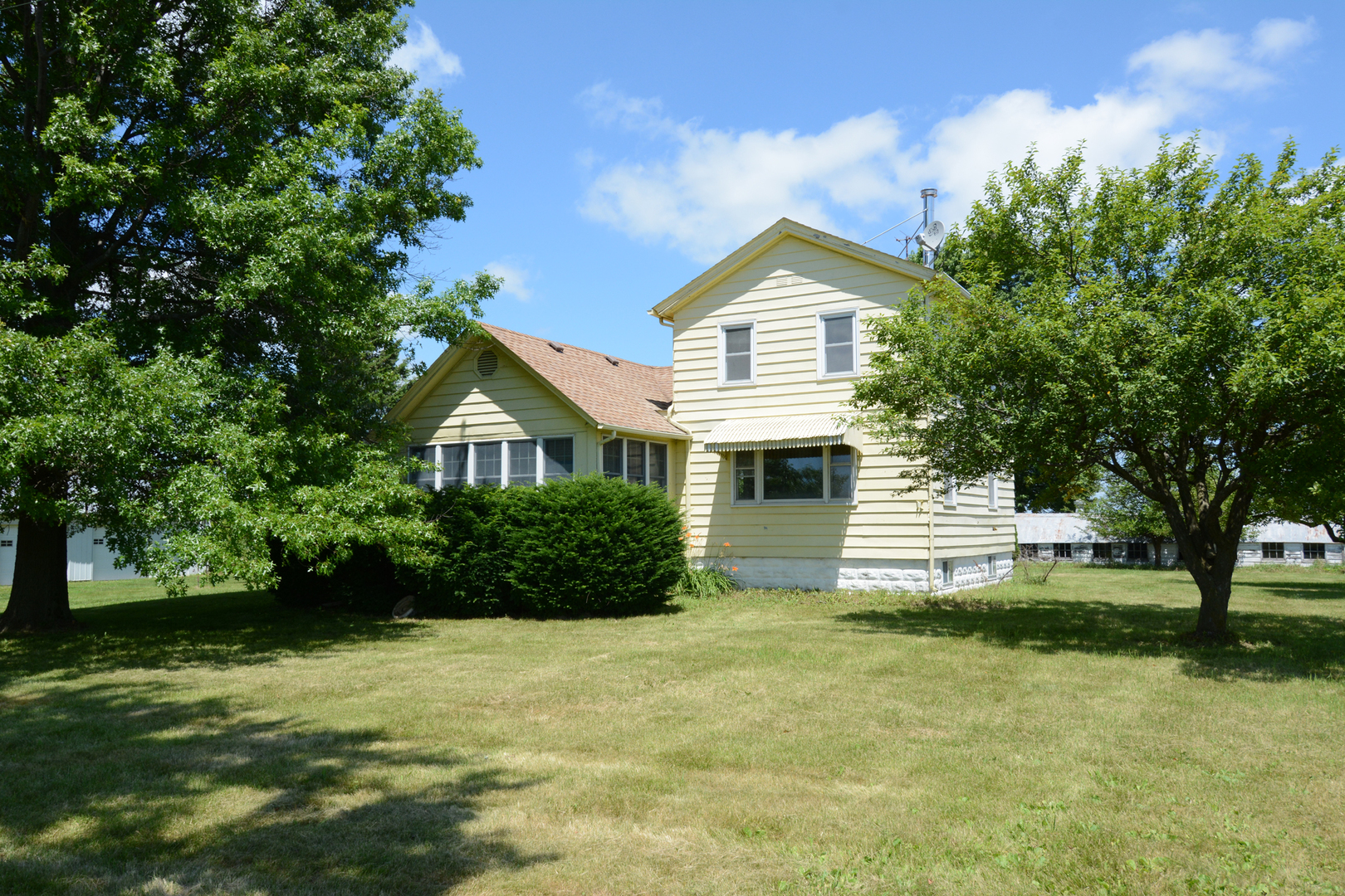 6115 South University Road Shabbona, IL 60550 - Photo 3 of 37 a front view of a house with a yard