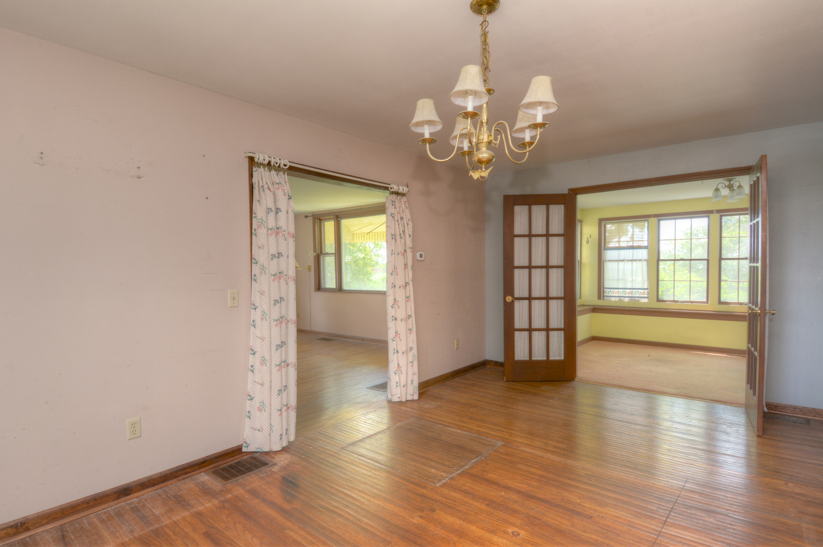 6115 South University Road Shabbona, IL 60550 - Photo 21 of 37 a view of an empty room with a window and wooden floor