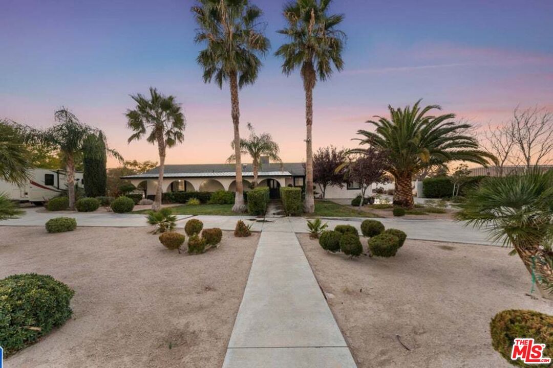 a view of a street with a car parked