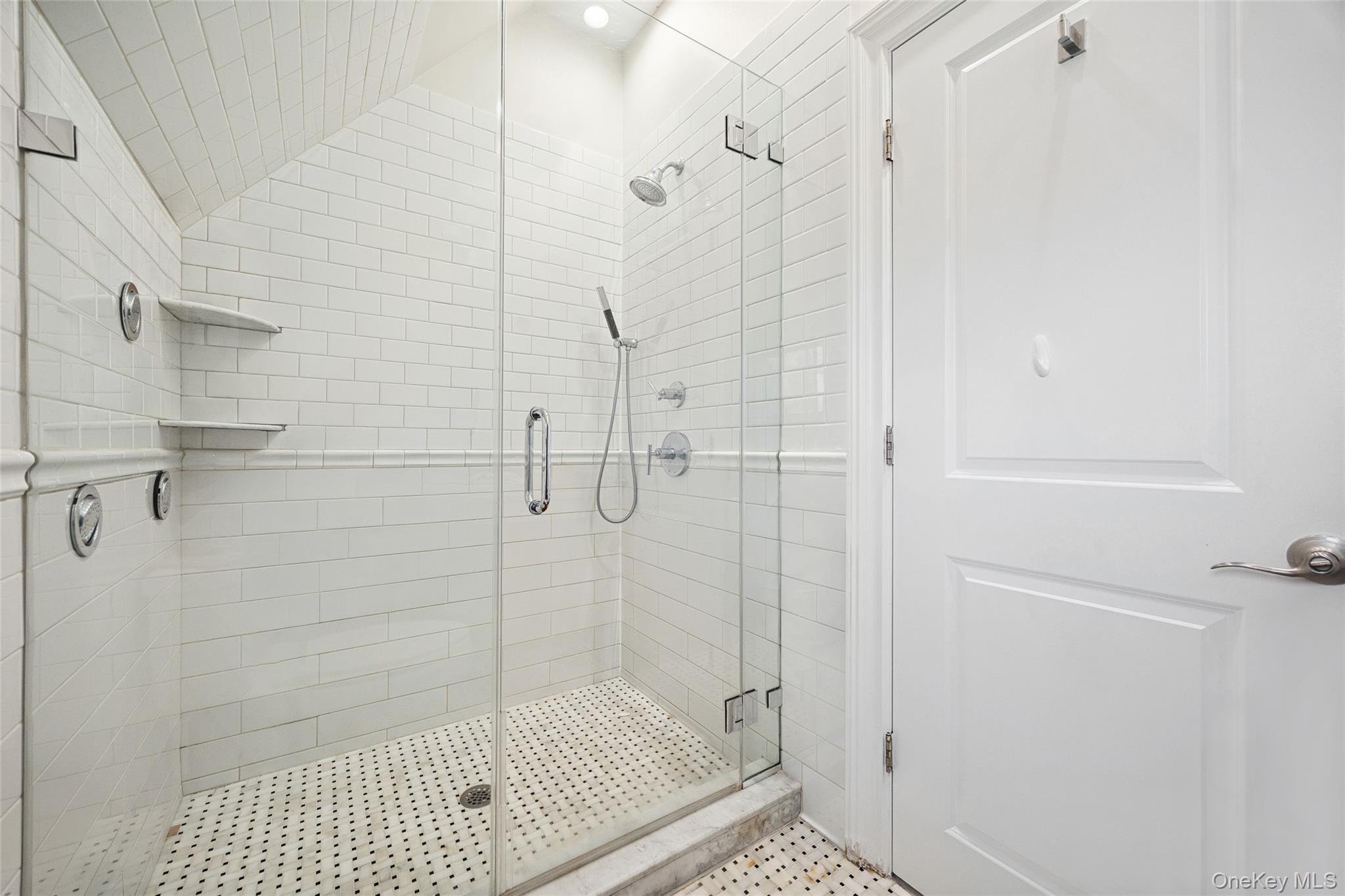 216 Beverly Road Queens, NY 11363 - Photo 16 of 50 a bathroom with a shower