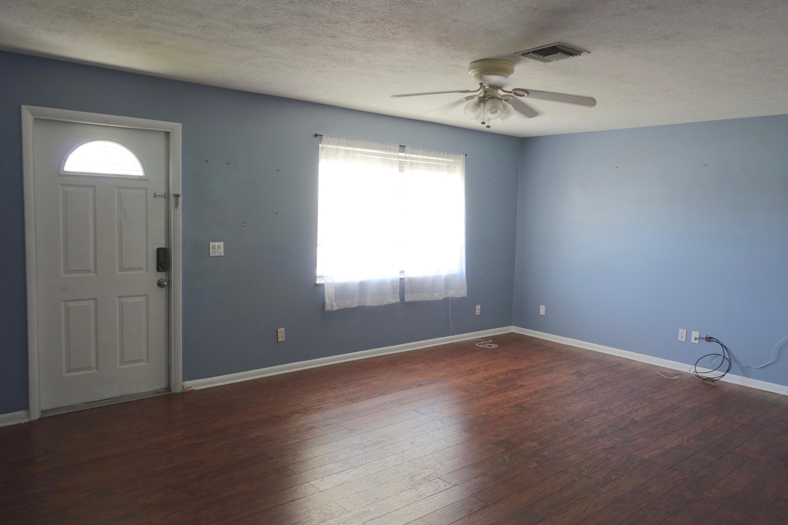 5619 Southeast Normandy Avenue Stuart, FL 34997 - Photo 2 of 16 5619 Normandy Living Room 1