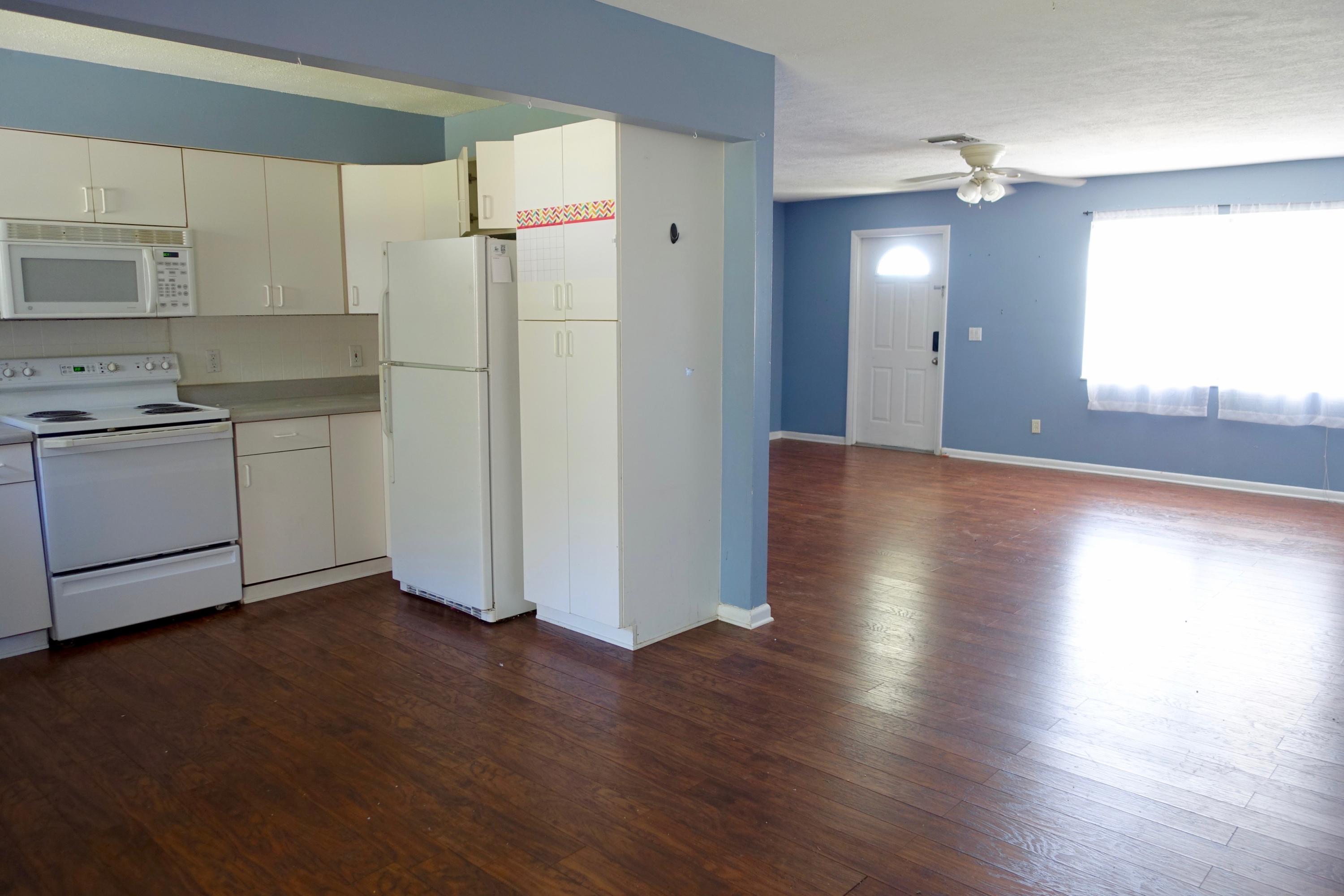 5619 Southeast Normandy Avenue Stuart, FL 34997 - Photo 4 of 16 5619 Normandy Kitchen - Living Area