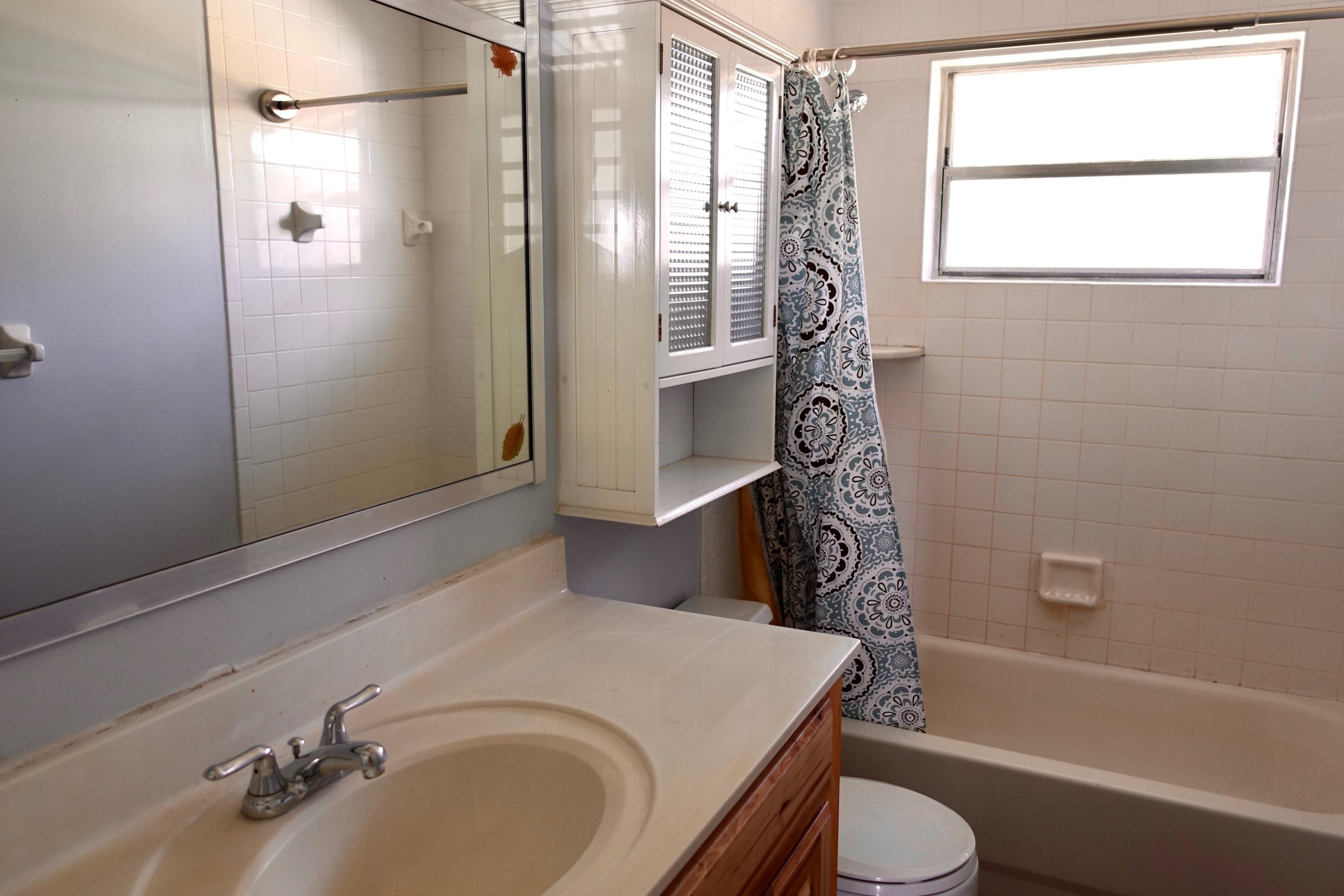 5619 Southeast Normandy Avenue Stuart, FL 34997 - Photo 8 of 16 5619 Normandy Bath 1