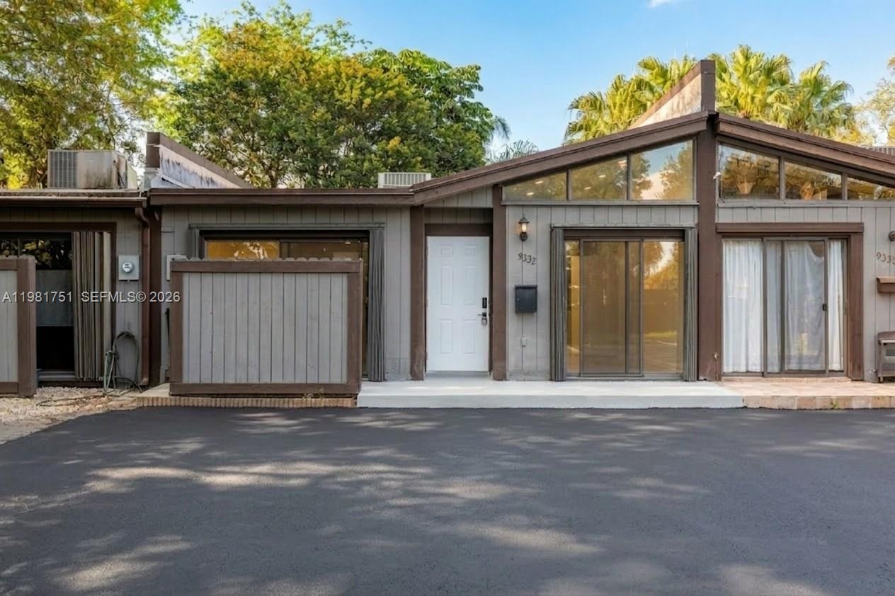 a view of a house with a small garden