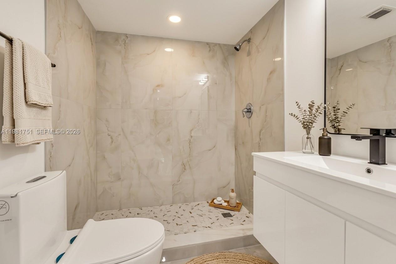 9332 Southwest 132nd Street Miami, FL 33176 - Photo 13 of 16 a bathroom with a sink toilet and shower