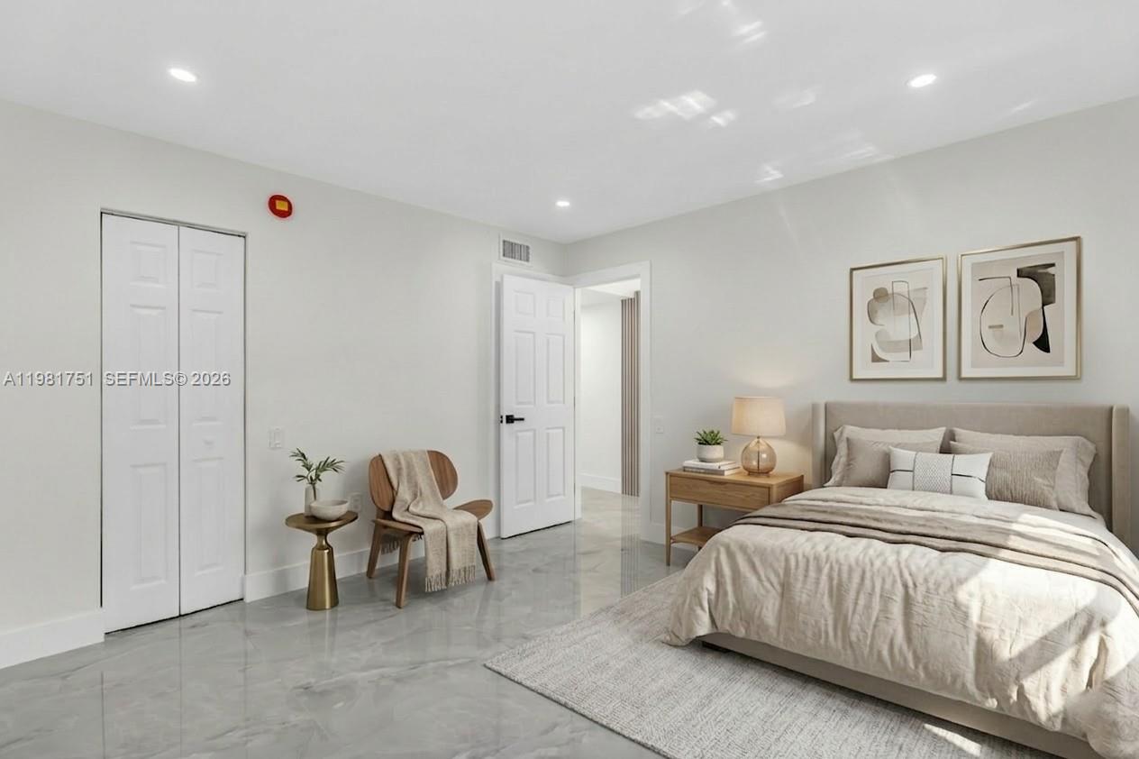 9332 Southwest 132nd Street Miami, FL 33176 - Photo 14 of 16 a bedroom with a bed and a chair