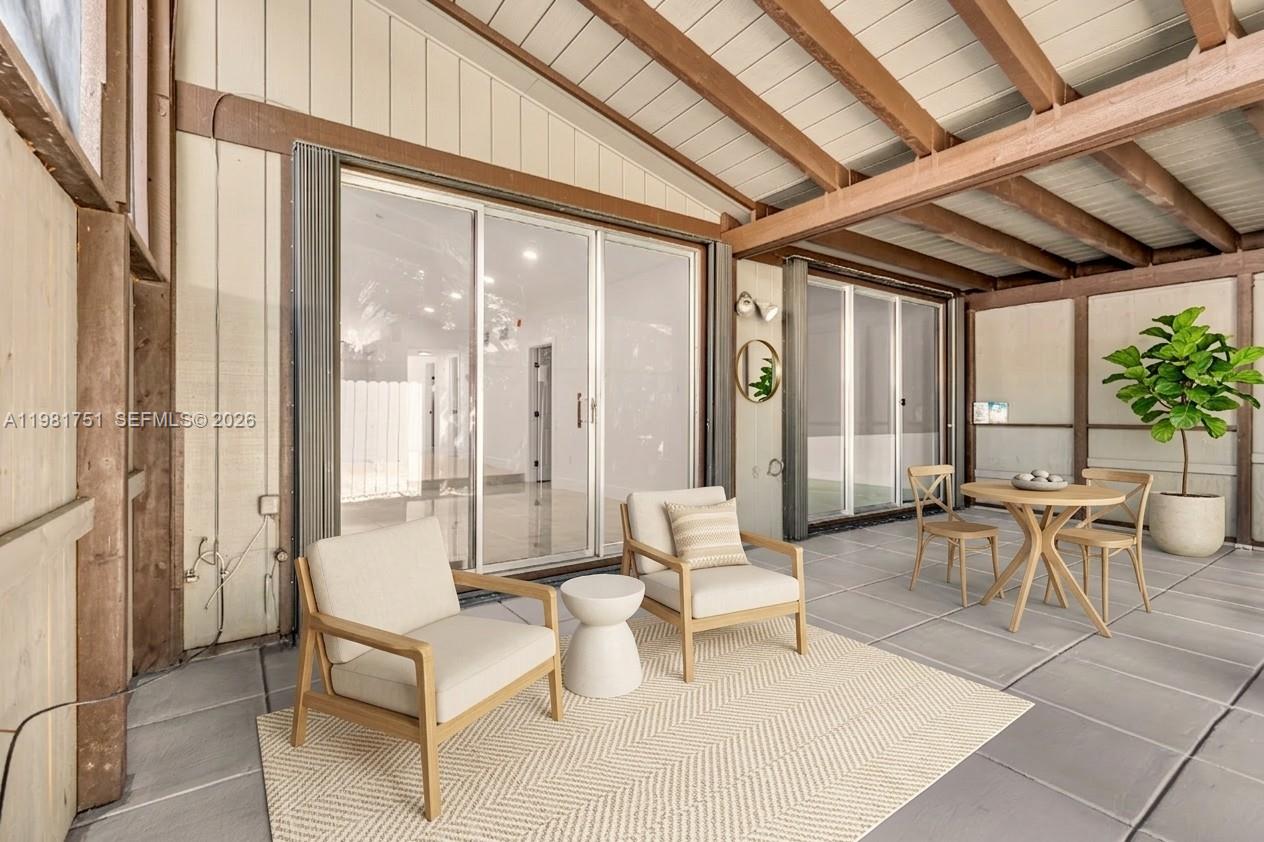 9332 Southwest 132nd Street Miami, FL 33176 - Photo 15 of 16 a living room with furniture and a large window